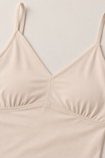 Z Supply Luxe Smooth Essential Tank in Frosted Pearl, close-up flat lay showing V-neckline, ruched underbust seam, and thin adjustable straps