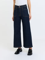 Daze Denim Valley Girl High Rise Patch Pocket Wide Ankle jeans in dark rinse, front view on model with black loafers