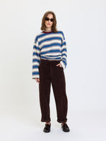Daze Denim Villa Pant Drawstring Barrel Pant in Chocolate corduroy, front view on model with cuffed hem and drawstring waist.