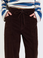 Daze Denim Villa Pant in Chocolate brown corduroy, close-up front view showing drawstring waist and patch pockets on model