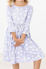 Mila Dainty Daisies 3/4 Sleeve Pocket Twirl Dress in lavender with white daisy print, front view on young girl