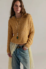 Opal Sweater in Sweet Potato by Tempemail.Pdf — chunky knit mustard-gold cropped pullover on model with jeans and lace layering piece