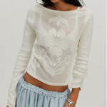 Free People Delilah Long Sleeve in Clean Ivory — pointelle floral knit top with long sleeves, worn with a light blue ruffle skirt, front view