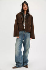 Free People Blair Vegan Suede Jacket in Chocolate Torte, front view on model with wide-leg jeans, oversized fit, chest pockets.