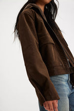 Free People Blair Vegan Suede Jacket in Chocolate Torte, close-up side view showing rich brown texture, zip front, and front pocket.