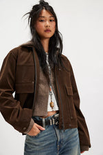 Free People Blair Vegan Suede Jacket in Chocolate Torte, oversized brown zip-up with patch pockets, worn open over layered tops with jeans.