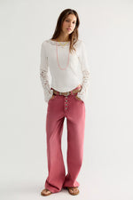 Free People Amber Lace Cuff top in white, worn by model with lace sleeves, ribbed knit body, and boat neckline with lace trim.