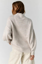 Free People Beaumont Tunic in Feather Grey Melange, back view on model, oversized knit sweater with ribbed hem and cuffs