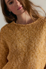 Tempemail.Pdf Opal Sweater in Sweet Potato — chunky knit crewneck sweater in warm mustard-gold, close-up front view on model