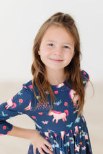 Mila Painted Skies 3/4 Sleeve Pocket Twirl Dress in navy blue with unicorn and floral print, worn by young girl