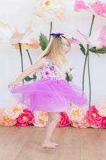 Mila & Rose Tank Tutu Dress in Purple Perfection - young girl twirling in floral bodice with purple tulle skirt