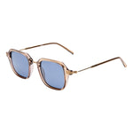 I SEA Riley sunglasses in taupe transparent frame with gold metal temples and navy blue polarized lenses, angled side view
