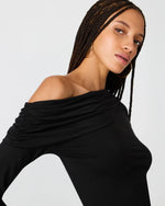 Steve Madden Ryder Knit Top in black, off-shoulder style with ruched sleeves, worn by model with box braids