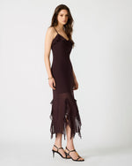 Steve Madden Mariane Dress in chocolate brown with ruffle details at neckline and asymmetrical hem, worn by model