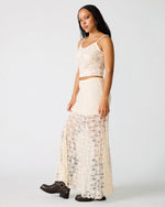 STEVE MADDEN Mirabel Skirt in cream lace worn by model with matching crop top and black boots on white background