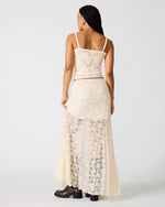 Steve Madden Mirabel Skirt in cream lace worn by model, back view showing semi-sheer maxi length with matching crop top