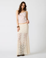 Steve Madden Mirabel Skirt in cream lace worn by model, featuring sheer lace panels and maxi length silhouette