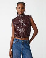 Steve Madden SC01142 cropped patent faux-leather vest in Deep Fig burgundy, front view on model with high-neck zip closure and chest pockets
