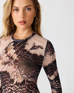 Steve Madden Sandy Knit Top in Moon Shadow print, long-sleeve mesh with abstract feather-like black and blush pattern, worn by model, front detail view.