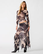 Steve Madden Sandy Knit Top in Moon Shadow print, long-sleeve crop top worn with matching maxi skirt and black heeled boots, front view.