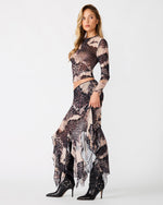Steve Madden Sandy Knit Top in Moon Shadow print, long-sleeve cropped fit on model styled with matching maxi skirt and black boots