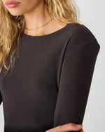 Steve Madden Sandy Knit Top in Dark Espresso, close-up detail view on model showing scoop neckline and long sleeves