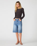 Steve Madden Sandy Knit Top in Dark Espresso, long-sleeve fitted crop top worn by model with wide-leg denim shorts, front view