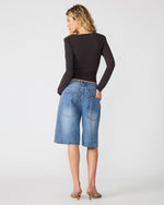 Steve Madden Sandy Knit Top in Dark Espresso, back view on model paired with wide-leg denim shorts and heeled mules