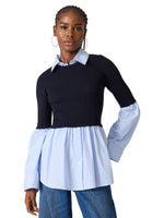 Steve Madden Lenny Knit Top — navy ribbed sweater bodice with light blue striped shirt hem, collar, and bell sleeves, front view on model