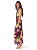 Steve Madden Rylen Dress in blurry floral print — deep purple maxi with pink and green blooms, racerback, side view on model