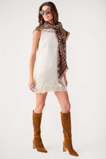 Z Supply Meadow Muse Lace Mini Dress in Frosted Pearl on model, sleeveless ivory shift with lace hem, styled with brown scarf and tan suede boots