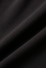 Z Supply Luxe Smooth Essential Tank close-up fabric detail in black, showing soft smooth knit texture with flowing drape