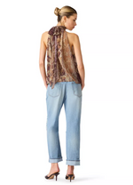 Steve Madden Alexane Top in bronze snake print halter style with neck tie, worn with light wash jeans, back view on model