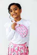 Mila Unicorn Kitties Belt Bag in pink with white cat faces, worn crossbody by a young girl in matching outfit