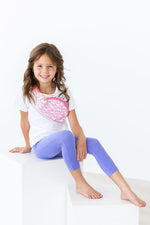 Mila Unicorn Kitties Belt Bag in pink with white cat print, worn crossbody by a young girl in white tee and purple leggings.