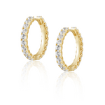 Sahira Piper CZ Hoops in gold, featuring round cubic zirconia stones set in yellow gold, shown as a pair on white background.