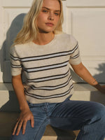 Z SUPPLY Gatewood Stripe Sweater in Light Oatmeal Heather with navy and blue stripes, short sleeves, worn by model with blue jeans