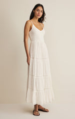 Z SUPPLY Behati Eyelet Midi Dress in white featuring tiered design, smocked bodice, thin straps, and eyelet details worn by model