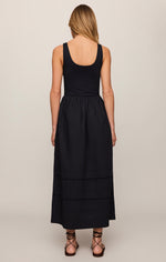 Z SUPPLY Johanna Midi Dress in Black, back view on model, scoop back bodice with gathered poplin skirt and tiered hem detail