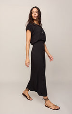 Z SUPPLY Anika Midi Dress in black, short-sleeve blouson top with elasticated waist and flowy maxi skirt, model side view