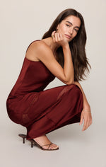 Z SUPPLY Bruna Lace Inset Midi Dress in Velvet Rouge — deep burgundy satin slip dress with lace panel detail, worn by model crouching