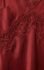 Z SUPPLY Bruna Lace Inset Midi Dress close-up detail showing floral lace trim against deep red satin fabric in Velvet Rouge