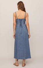 Z SUPPLY Leonora Indigo Midi Dress back view — denim maxi with smocked bodice, lace-up corset back, spaghetti straps, and flared skirt