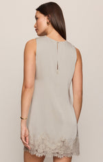 Z SUPPLY Meadow Muse Lace Mini Dress in Frosted Pearl — back view on model, sleeveless satin shift with lace hem trim