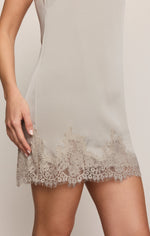 Z Supply Meadow Muse Lace Mini Dress in Frosted Pearl, close-up detail of floral lace hem trim on satin slip dress