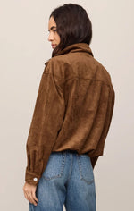 Z Supply Corin Bubble Hem Jacket in Saddle Suede, back view on model, cropped brown faux suede with collar and snap cuffs