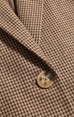 Z SUPPLY Evan Check Blazer close-up detail showing houndstooth pattern in dark chocolate and tan with a natural horn-style button