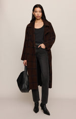 Z SUPPLY Crosby Plaid Cocoon Coat in Dark Chocolate, a long oversized brown plaid teddy coat worn by a model with dark jeans and black boots.