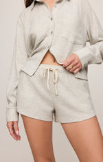 Z SUPPLY Waffle Short in Feather Grey with cream drawstring waistband, worn by model with matching waffle knit button-up top.