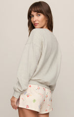 Z SUPPLY Home Grown Sweatshirt in Feather Grey shown on model, back view, paired with floral 'Locally Grown' shorts